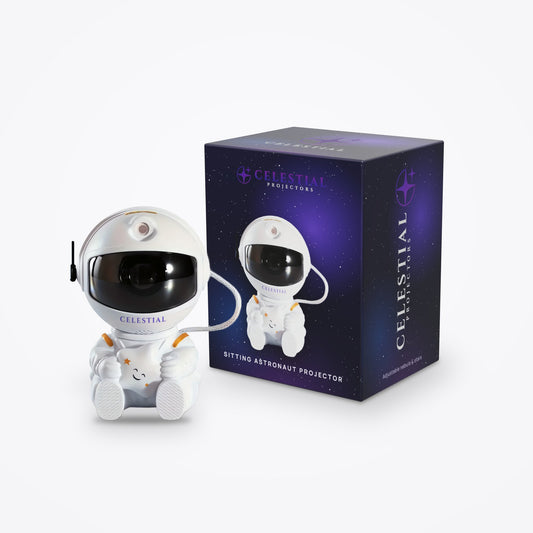 Sitting Astronaut Projector by Celestial Projectors with its branded gift box